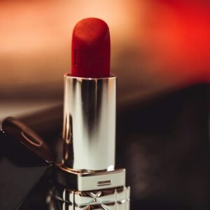 Close-up of red lipstick showcasing luxurious cosmetic design.